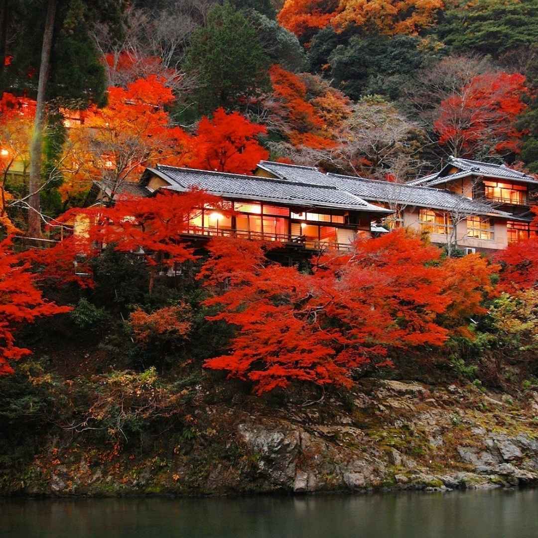 HOSHINOYA Kyoto surrounded by autumn foliage beside the river in Arashiyama